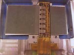 Рис. 1. SCT-модуль, содержащий 4 детектора Hamamatsu; 2 на верхней поверхности и 2 — внизу, повернуты на некоторый угол. На мостике над детектором видны 6 заказных ИС